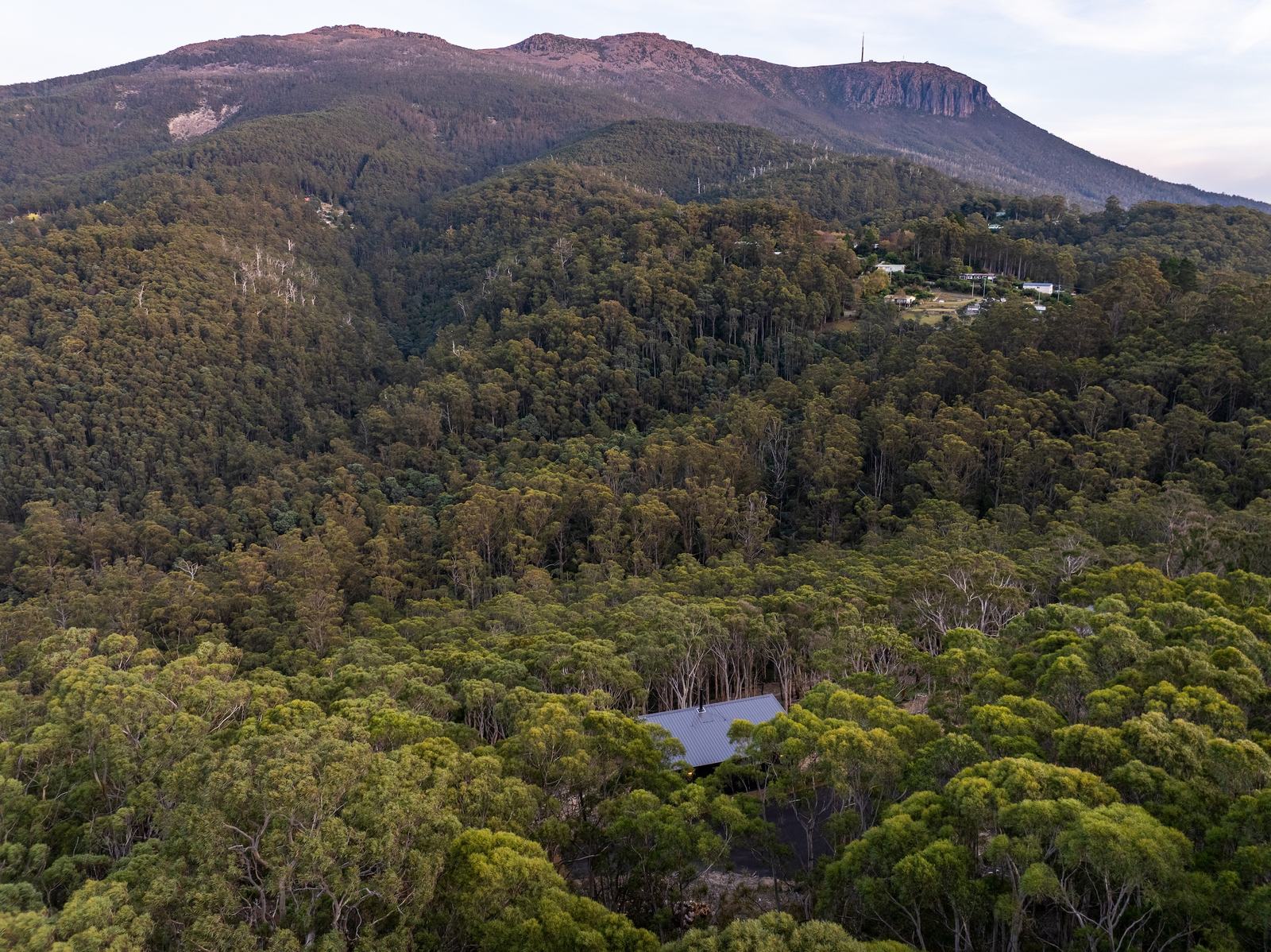Drone picture of 3 cabins overlooking the forest