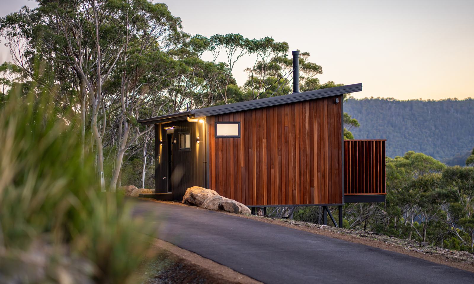 Timber-clad Breath cabin surrounded by native forest in Fern Tree.